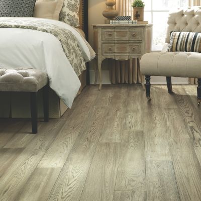 rustic hardwood floors in a cozy bedroom